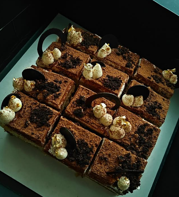 Gourmet tiramisu squares with chocolate curls and gold leaf - Vivante Patisserie